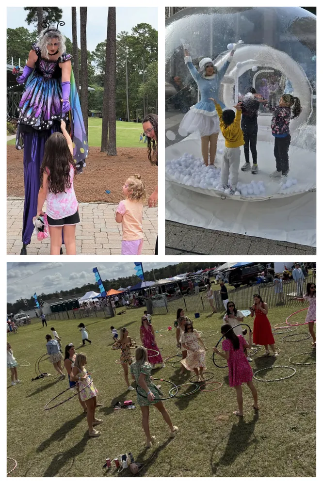 Kids Zone with a stilt walker, giant bubble ball and children dancing on the lawn