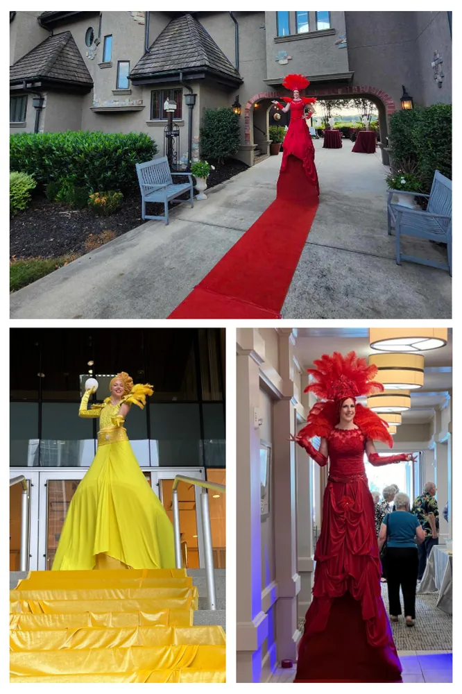 Living red carpet performers in long yellow and red gowns that form the carpet